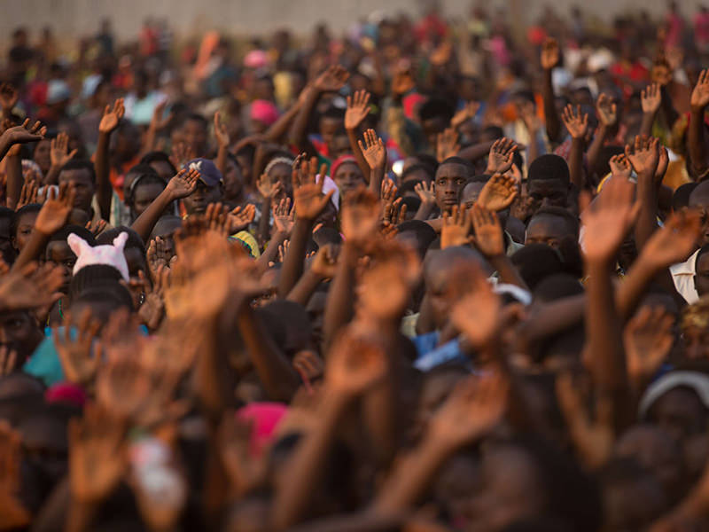 Crowd of People with their Hands Raised 1